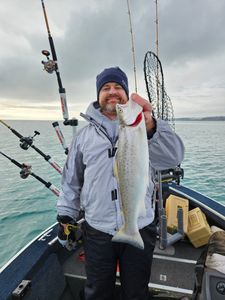Angler holding a beautiful rainbow trout in Wisconsin