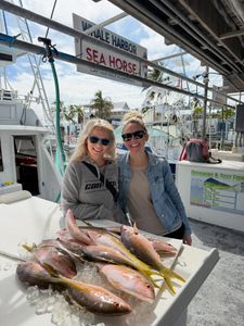 Two anglers successfully fishing in Islamorada