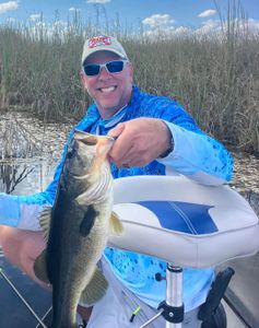 An angler fishing in Islamorada with a 18-inch catch