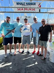 Successful fishing trip displaying king mackerel catch at Whale Harbor marina in Islamorada, Florida