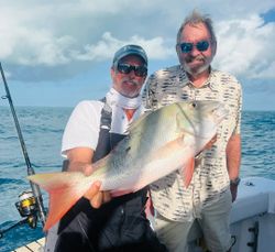 Two people fishing on the beach in Florida