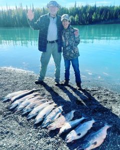 Smiling with family and fresh salmon