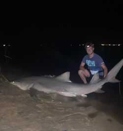 A person fishing in the water in FL