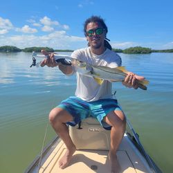 Angler holding a 14-inch fish in FL