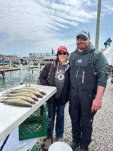 Two people fishing in MI