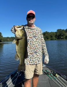 Angler holding a large Florida bass in TX