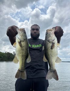 Two Florida Bass and Largemouth Bass measuring 29 inches, fishing in Madisonville