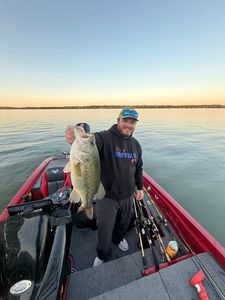 Bass fishing success on calm water in North Tonawanda NY with large catch displayed on boat