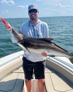 A person fishing in the waters of Virginia Beach