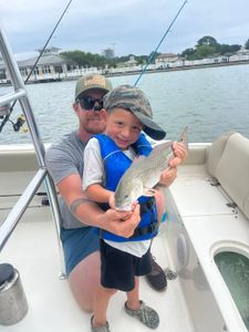 Two people enjoying a day of fishing and water sports in VA