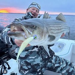 Two people fishing in the water in VA