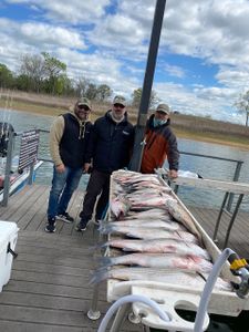 A group of 3 people fishing in OK