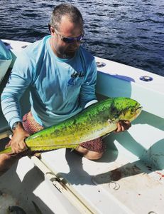 One fisherman catching a 20-inch fish in Scituate