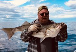 A fisherman with a 13-inch catch