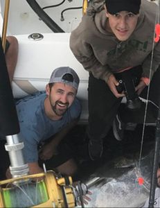 Two anglers enjoying a fishing trip in Scituate