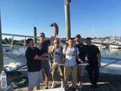 Group of 6 people fishing at an undisclosed location