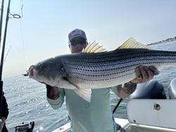 Reeling in striper action off the coast of Scituate!