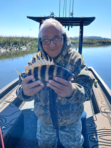Spending a peaceful day on the water, reeling in a great catch.