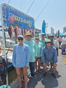 Reeled in a feisty red snapper during an epic fishing adventure in Biloxi!