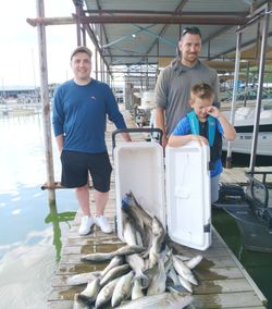 Three anglers enjoying a great day of fishing in Pottsboro