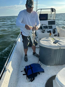 Angler holding a 12-inch freshwater fish in Pottsboro