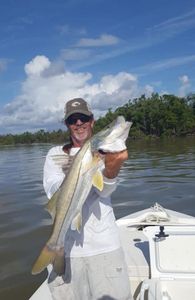 A fisherman catches a snook in Islamorada