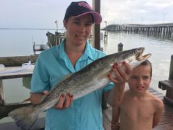 Two anglers with a big fish in Aransas Pass