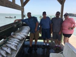 Group of four people fishing in TX