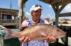 Angler reeling in a big catch at Aransas Pass