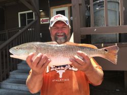Angler holds a large redfish in TX