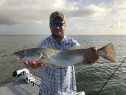 A lone angler fishing in Aransas Pass