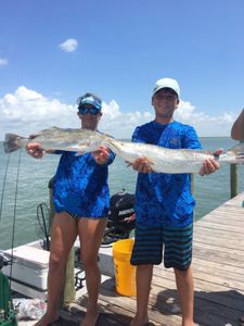 Two anglers fishing with rods in TX