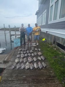 Two anglers with a big 27-inch fish in NC
