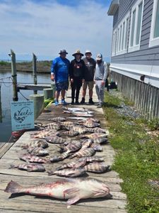 A group of 4 people fishing at Hatteras