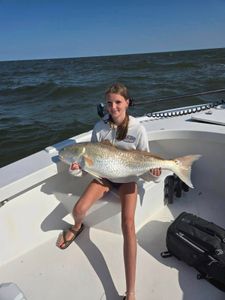 A redfish measuring 32 inches caught while fishing in Hatteras