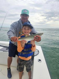 Fisherman with a 15-inch Spanish Mackerel in Hatteras