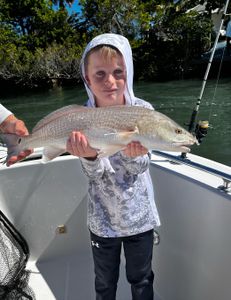 Proud young angler with a beautiful Redfish!