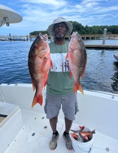 Vibrant Mutton Snapper haul and proud smiles!