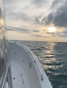 Peaceful sunrise cruise on open water.