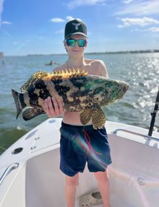 Angler holding a 25-inch fish in FL