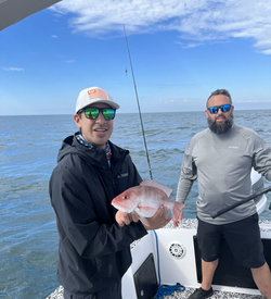 A pair of anglers enjoying a fishing tour in FL
