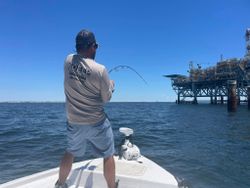 Captain Walsh battling a big one near the rig.