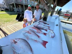 4 people fishing in the Gulf Shores