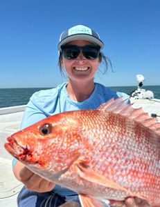 Fisherman with a 19-inch catch in Gulf Shores