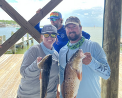 2 fishing rods with a catch of 2 fish in Alabama