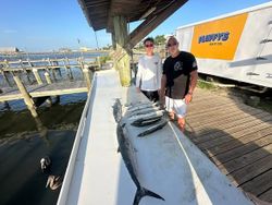 King mackerel catch displayed on boat deck at Gulf Shores AL fishing dock