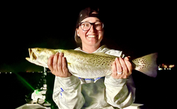 Angler holding a fishing rod with the location 'AL'