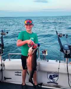 A lone angler reeling in a 24-inch catch in NY