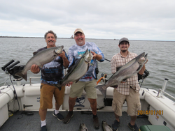 Three anglers fishing in Oswego