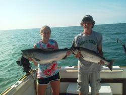 Two anglers enjoy a successful fishing trip in NY